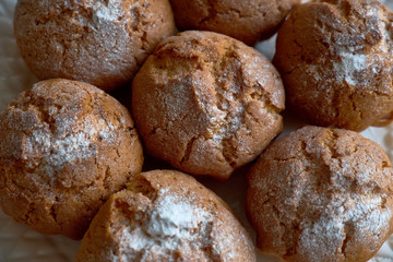 A plate of freshly made muffins with sugar for breakfast
