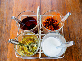 Garnish noodles seasoning Thai style on wood table- sugar, dried.