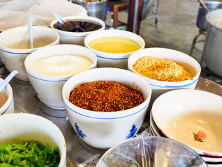 Garnish noodles seasoning Thai style on wood table- sugar, dried.
