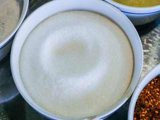 Garnish noodles seasoning Thai style on wood table- sugar, dried.