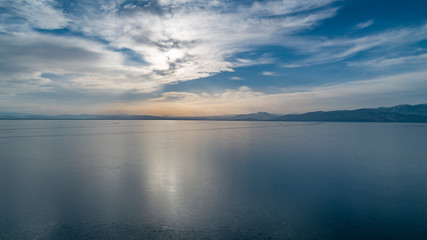 Fototapeta na wymiar winter frozen lake and sunrise view