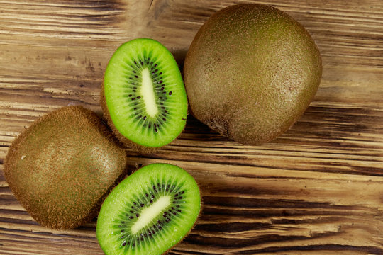 Kiwi fruits on wooden table. Top view