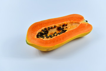 Slices of papaya on white background.