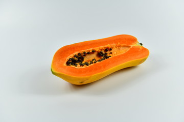 Slices of papaya on white background.