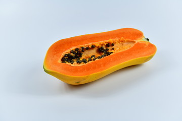 Slices of papaya on white background.