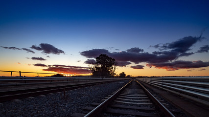  Evening and vivid sunset on the railroad tracks