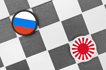 Draughts (Checkers) - Russia vs Japan -  problem, tension, conflict, clash and war between Russian...