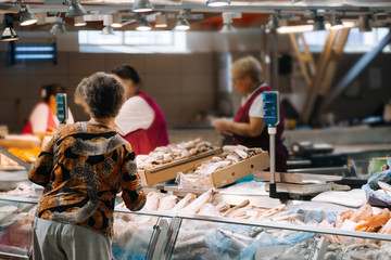 Customer buy a seafood at the fish market