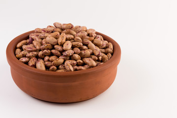A plate of beans on white background