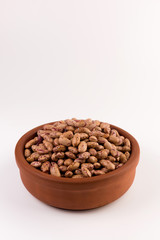 A plate of beans on white background