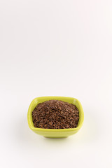 flax seeds in bowl on table background