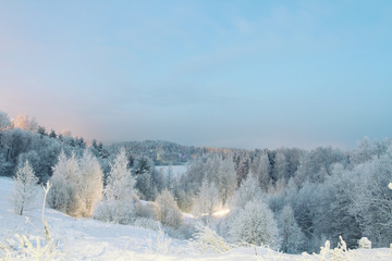 winter evening landscape, snow-covered panorama from the hills