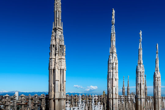 Milan Duomo spire detail in a sunny day and blue sky - Milan city italy