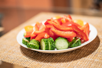 Vegetarian salad from cucumber, pepper and tomato, vegan meal