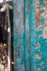 cracked blue paint on a wooden surface