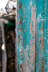 cracked blue paint on a wooden surface