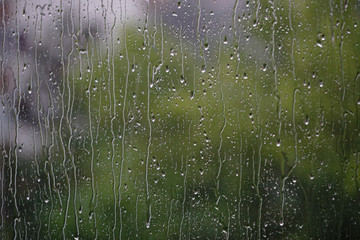 Raindrop on the glass bokeh effect texture template background