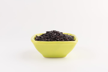 bowl of black wild rice isolated on white background