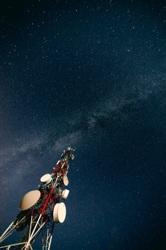 Communication tower and sky with stars in evening
