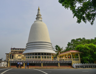 Giant Buddhist stupa on street of Colombo