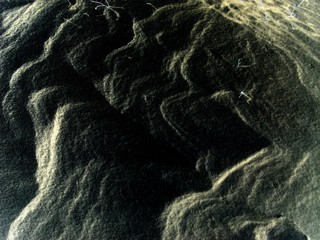 Beautiful white snow texture, formed by the winter wind. Waves and Dunes