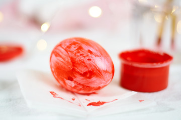 Painting easter eggs with paint bright spring holiday activity concept