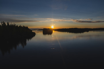 Sunset over a lake during midsummer in Finland