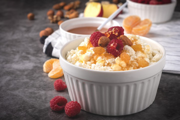 cottage cheese with fresh berries, honey, apples,  tangerines, and nuts, healthy breakfast, diet vegetarian food