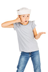 Little girl wearing a sailor costume and looking at the camera on white background.