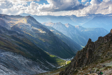 Landscape with Swiss alpine mountains with glaciers and sunset.