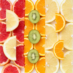 Creative pattern of sliced fruits - kiwi, orange and grapefruits, close up