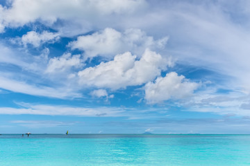 Fototapeta na wymiar Beautiful marine view on tropical caribbean beach with turquoise water under blue sky and clouds at sunny day as natural background - Valley Church Beach at Antigua and Barbuda island