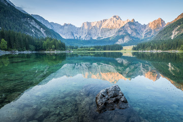 Superior Fusine Lake with Mount Mangart on the background. Fusine Lakes Natural Park, Tarvisio, Udine province, Friuli Venezia Giulia, Italy.