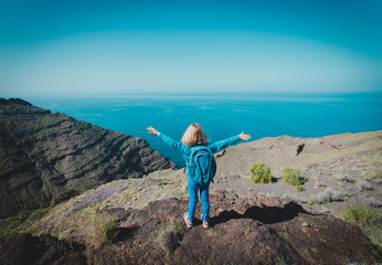 happy little girl enjoy travel in mountains
