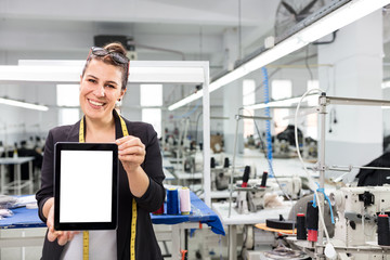 Woman holding digital tablet.