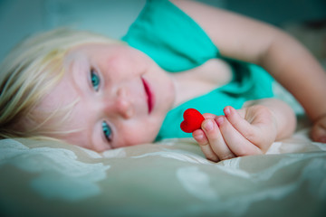 love and family. little girl holding heart in hands