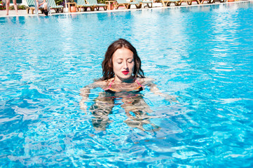 Sexy woman in swimming pool. caribbean sea. Dope. Spa in pool. Sexy girl with red lips and wet hair. Miami beach is sunny. Swag. Summer vacation and travel to maldives. swim suit on beach