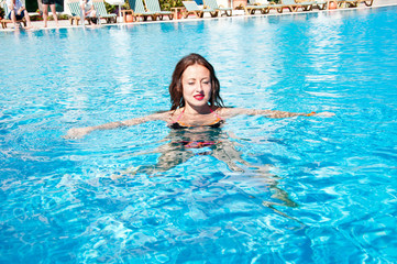 Summer vacation and travel to maldives. caribbean sea. Dope. Spa in pool. Sexy girl with red lips and wet hair. Miami beach is sunny. Swag. Sexy woman in swimming pool. Getting golden tan