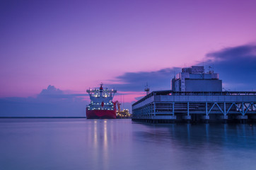 LNG TANKER - Ship at dawn moored to the gas terminal
