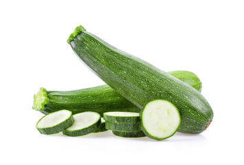 fresh green zucchini with slice isolated on white background