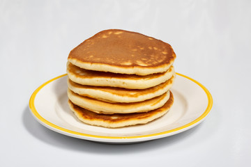 Pancakes on a white plate close up