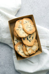 Homemade cat's tounge cookies with milk on marble background. Langues de chat.