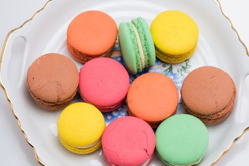Multi-coloured macarons on white