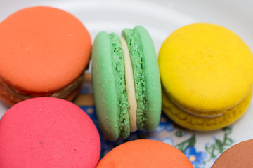 Multi-coloured macarons on white