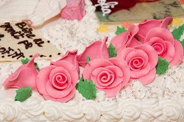   wedding cake at wedding reception.,pink  rose