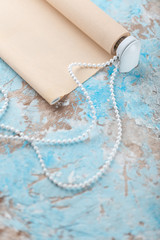 The roller blind lies on the old white and blue cracked surface.