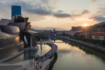 Bilbao, Spain - July  08, 2018- sunset view of modern and contemporary art Guggenheim Museum, designed by American architect Frank Gehry and inaugurated in October 1997