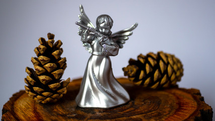  Angel figurine on a gray background