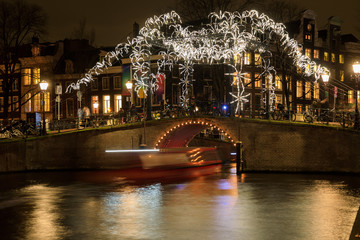Light installation in the form of glowing spiders, Amsterdam