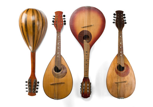 Four different mandolins isolated on a white background. Baroque string musical instruments.